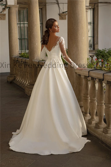 2024 Long Sleeve Satin Wedding Dresses Elegant Women's Round Neck Lace Applique Princess Bridal Dress Sheer Sexy Open Back Robe